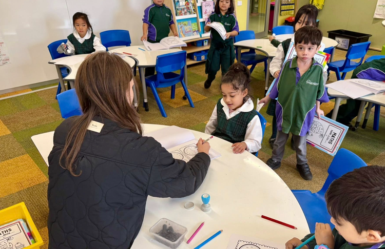 Teacher and students in the classroom doing learning