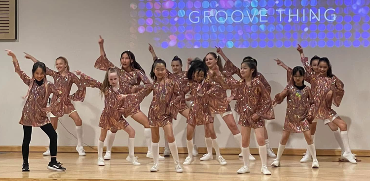 Photo of dance group performing in the school hall